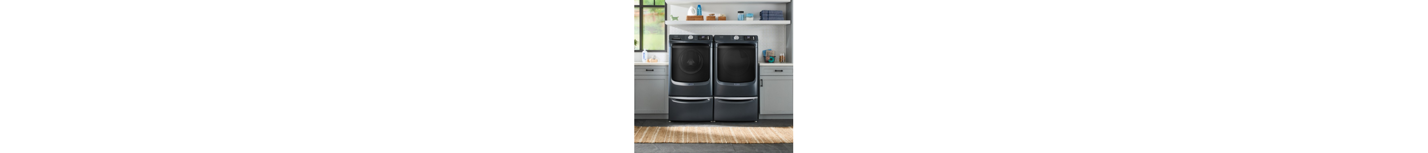 Front load washer and dryer on laundry pedestals