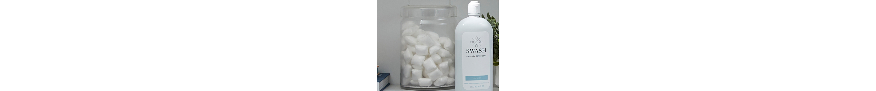 Bottle of liquid detergent next to jar of laundry pods
