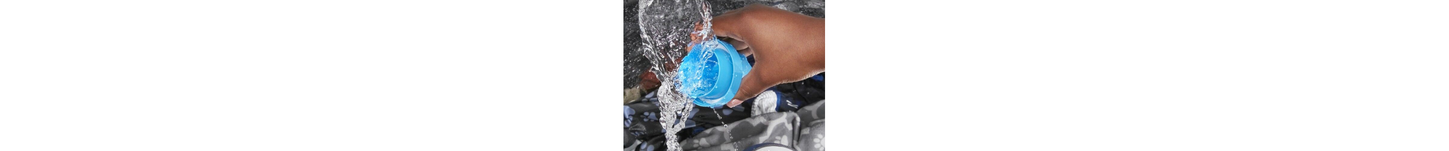 Hand pouring liquid detergent into washing machine