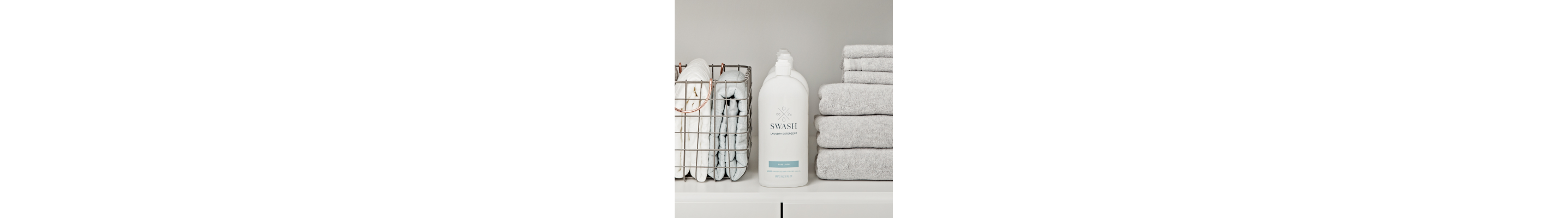 Swash™ detergent bottle in a laundry cabinet