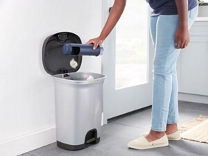 A close-up of a person cleaning a washer filter
