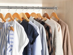 Shirts on hangers in a closet