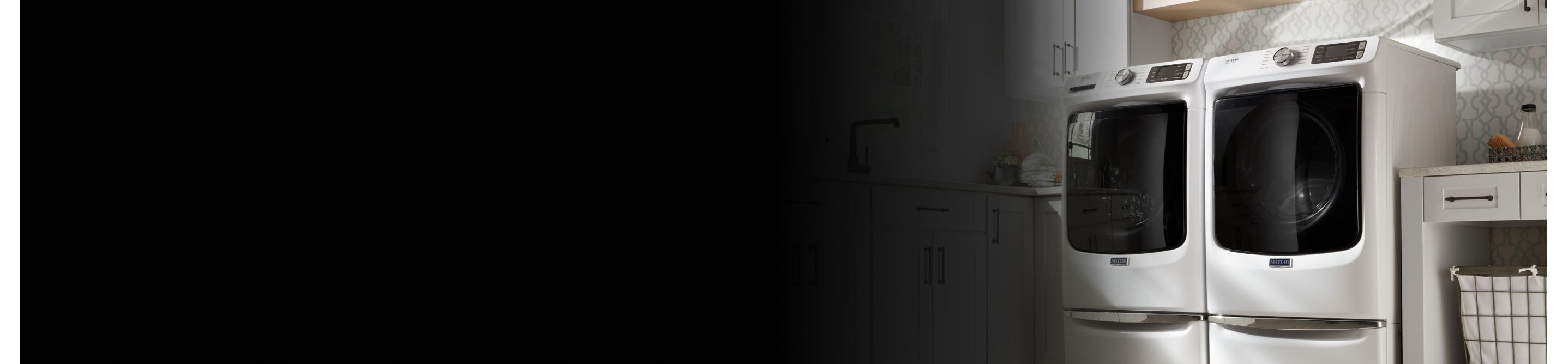 A white Maytag® dryer in a laundry room
