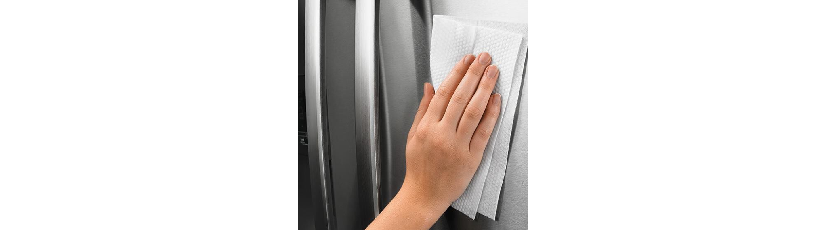 Person buffing streaks out of stainless steel with a clean, dry cloth