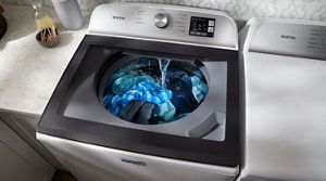 Top loading washing machine deals leaking from bottom