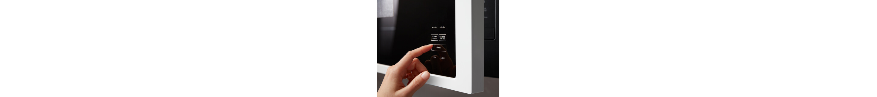Person selecting a setting on a Maytag® microwave