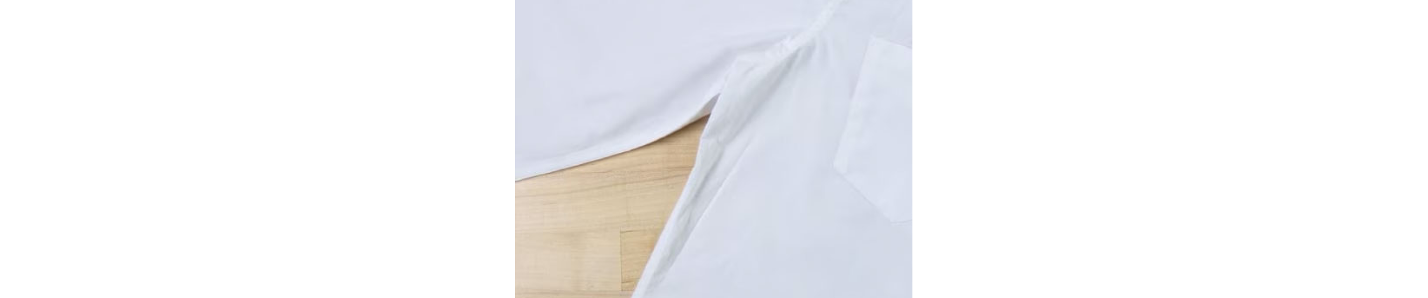 Close-up of pit stain on a white dress shirt