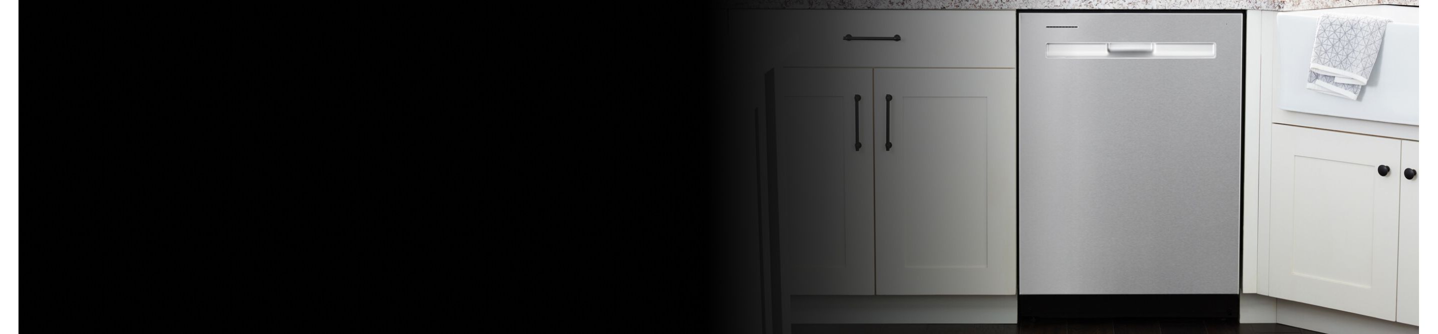 A Maytag® dishwasher surrounded by white cabinetry