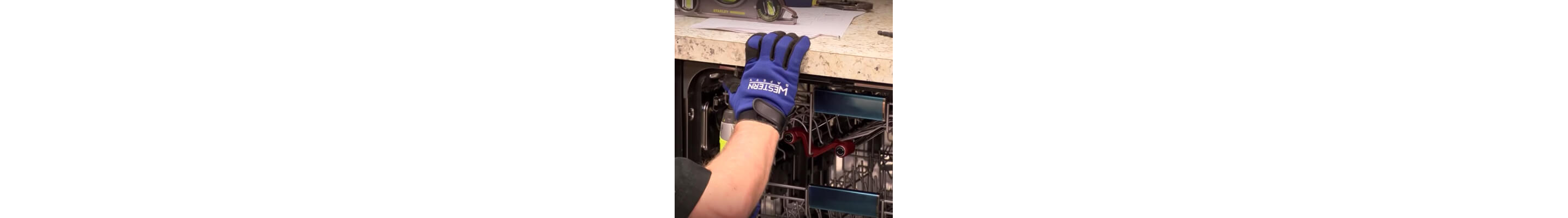 A blue glove gripping the counter above an opened dishwasher