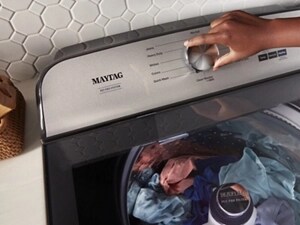  Person adjusting the controls on their Maytag® Pet Pro Washer