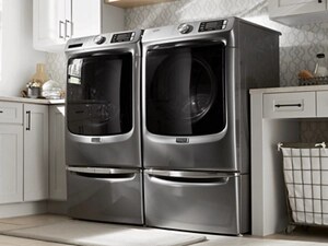 A stainless steel Maytag® washer and dryer pair in a laundry room