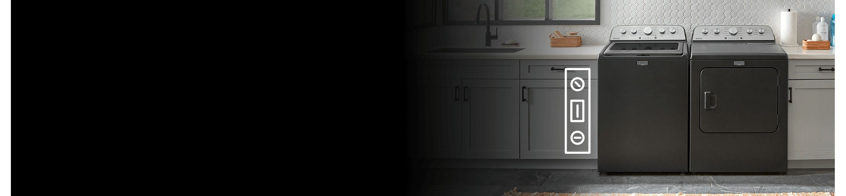 A black Maytag® washer and dryer surrounded by countertops