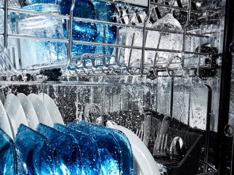 Dishes going through a wash cycle