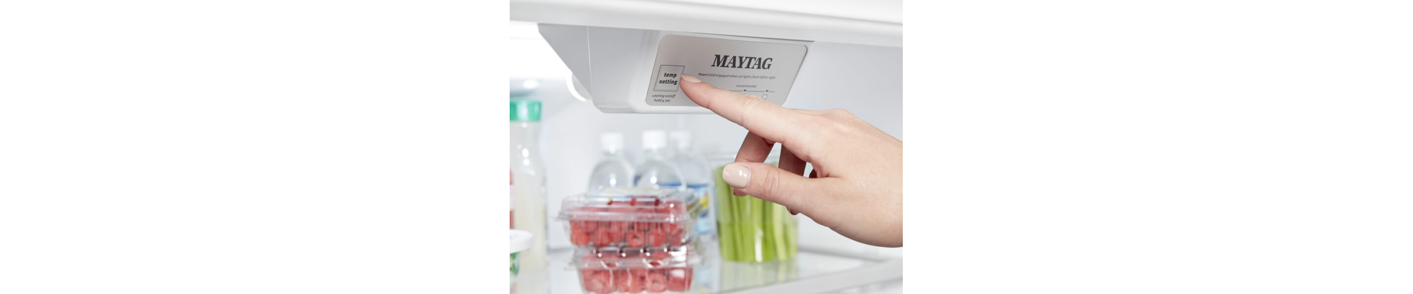 Person selecting a setting on a Maytag® refrigerator