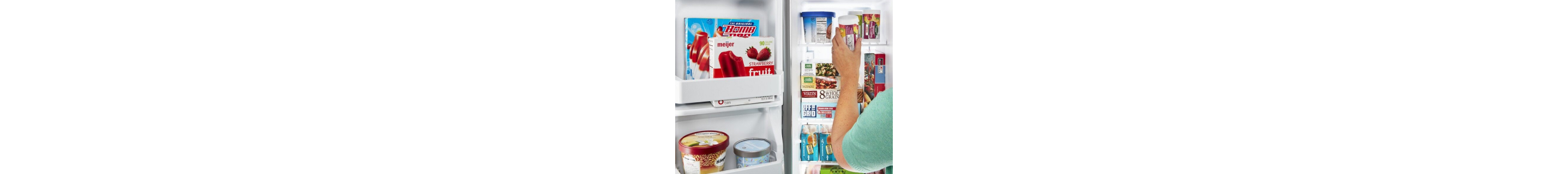 A woman removing an item from a side-by-side fridge freezer compartment