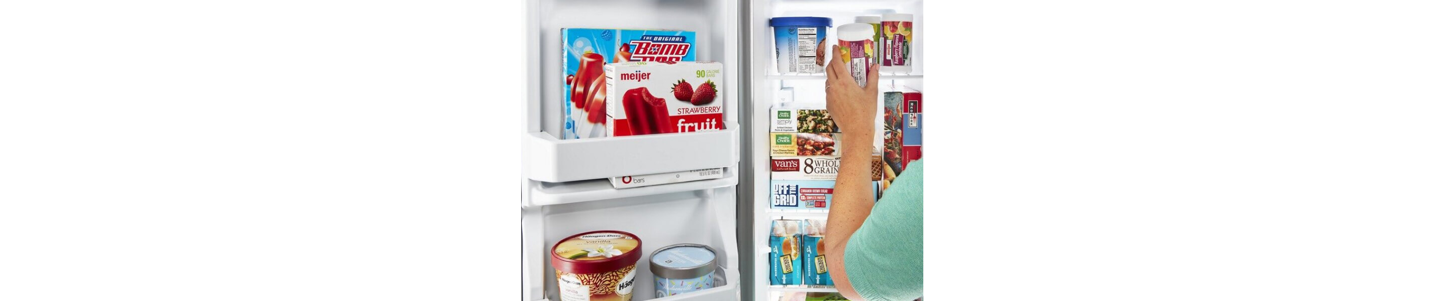 A woman removing an item from a side-by-side fridge freezer compartment