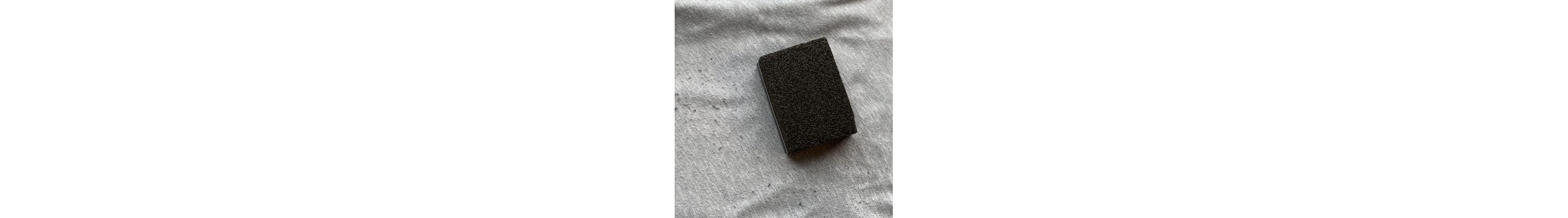 A sweater stone on a pair of sweatpants with fabric pills