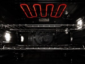 The inside of an oven range heating up