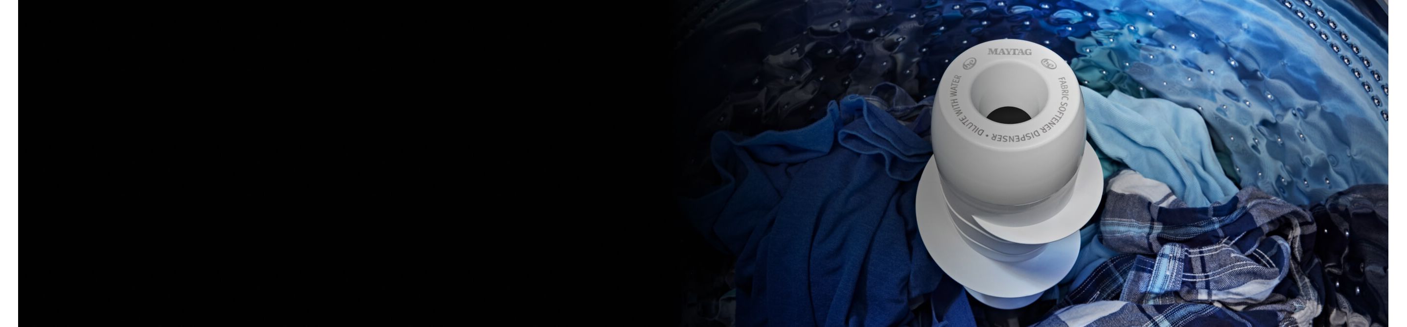 Agitator surrounded by blue clothes in Maytag® top load washer