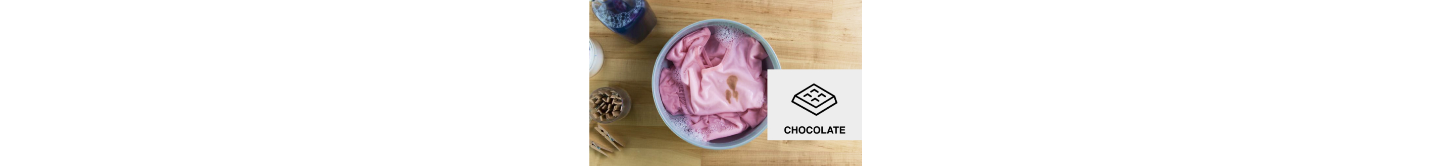 Chocolate-stained clothing in a soapy container