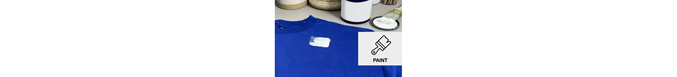 Blue t-shirt with a white paint stain