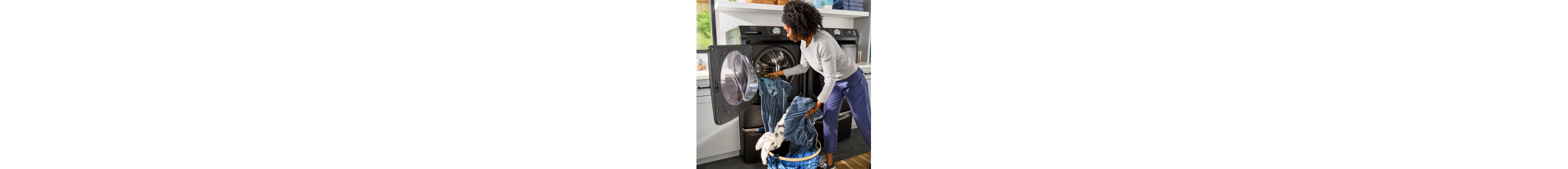 Person removing clothes from a washing machine