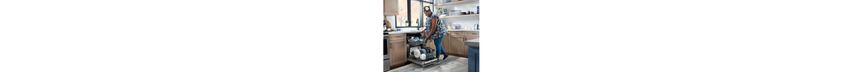 Person loading dishes in a dishwasher
