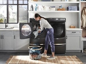 Person unloading their Maytag® washing machine