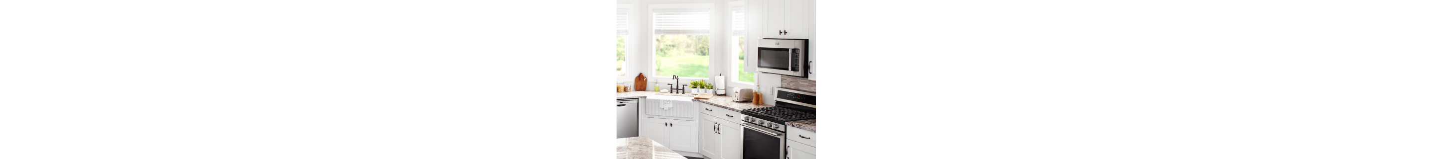 View of farmhouse kitchen with Maytag brand appliances