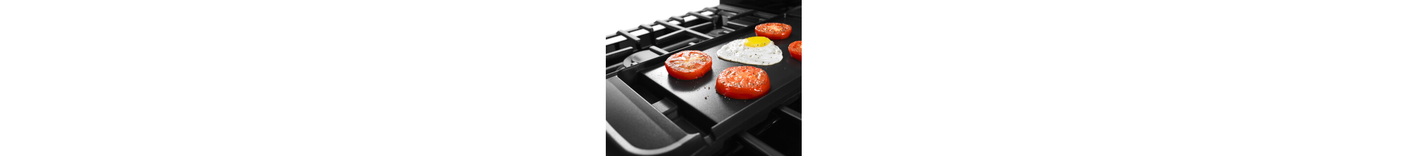 Food cooking on a stovetop griddle