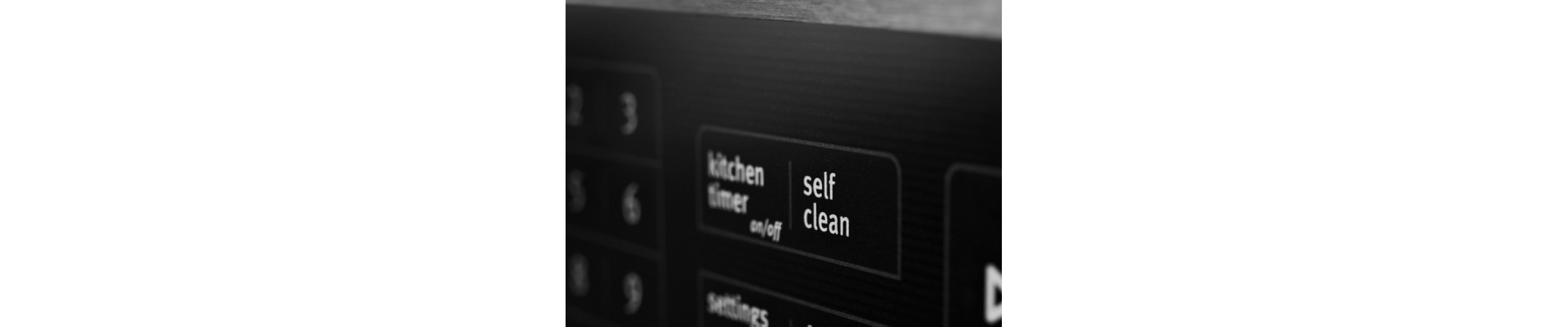 Close-up of self clean button on oven control panel
