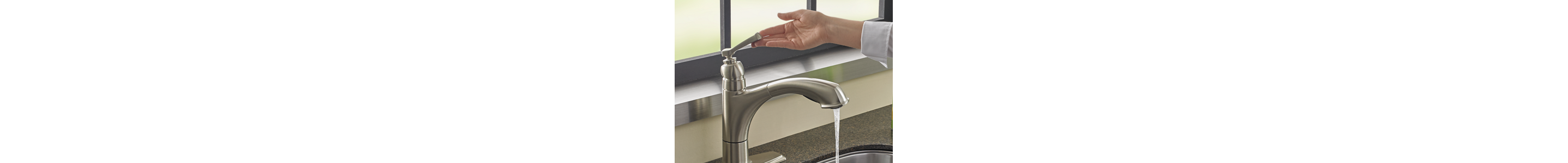 A person turning on a sink faucet