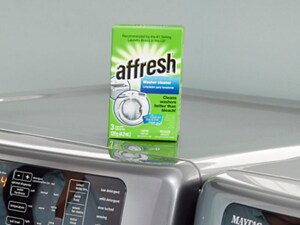 A box of affresh® Washing Machine Cleaner tablets on top of a washing machine