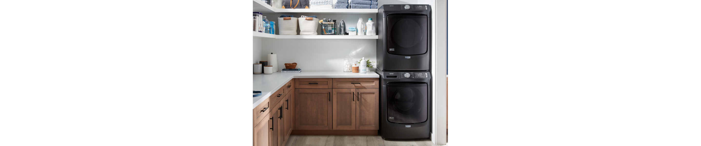 Stacked Maytag® washer and dryer in laundry room