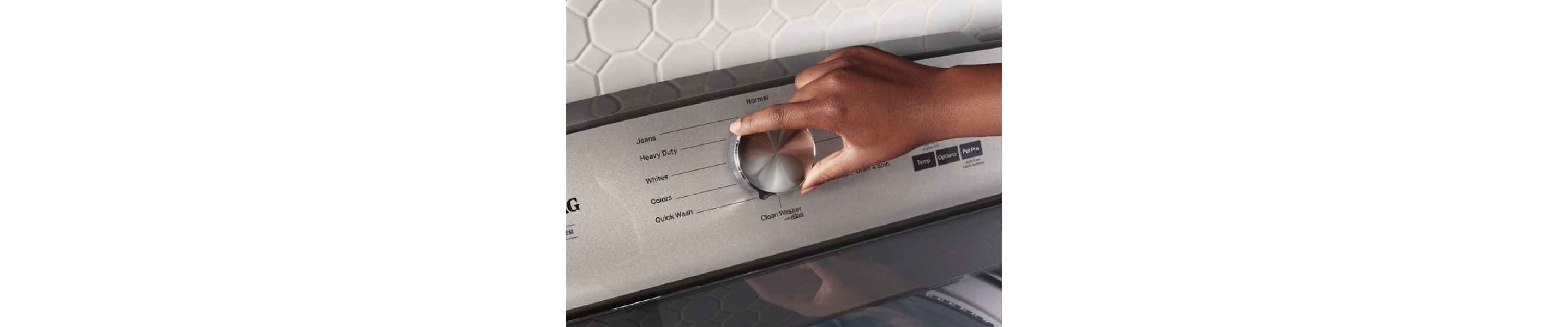 A person selecting a wash setting on a Maytag® top load washer