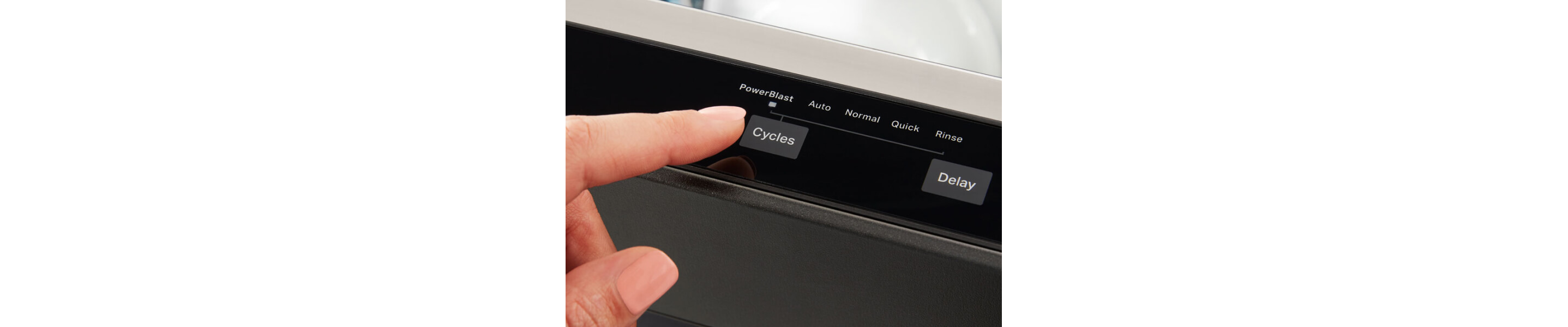 A finger selecting a dishwashing cycle