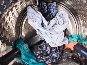 Clothes tumbling inside of a washer