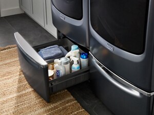 Open washer pedestal with laundry supplies inside