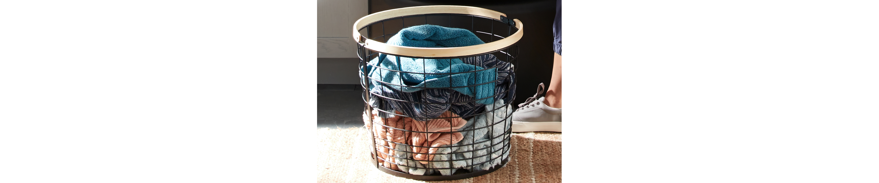 Wire laundry basket filled with towels