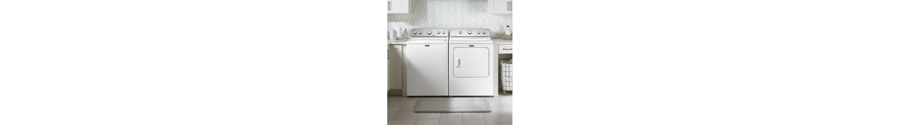 White Maytag® top load washer and dryer set in laundry room 