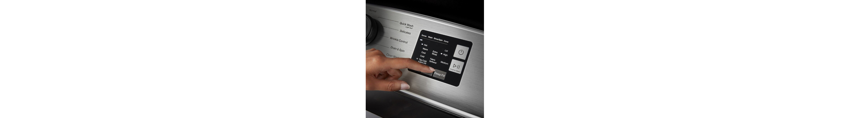 Close-up of person selecting washer cycle settings