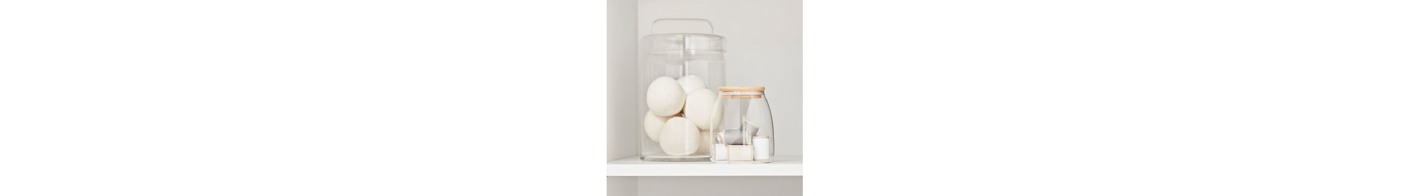Glass jar with wool dryer balls