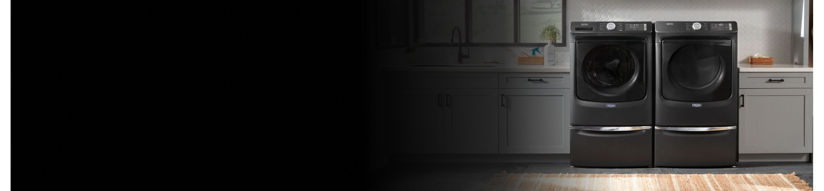 Maytag® side-by-side washer and dryer set in a modern laundry room