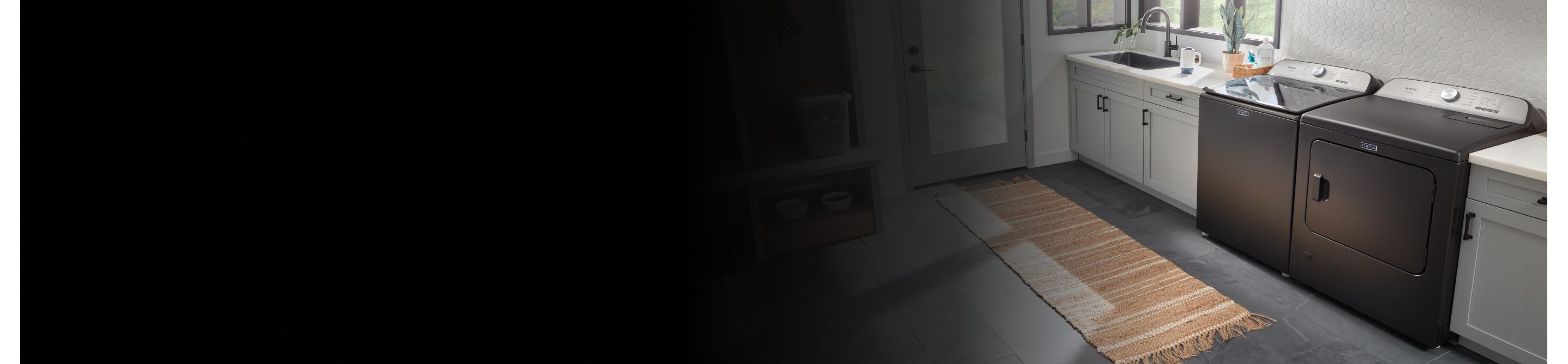 Grey washer and dryer in laundry room