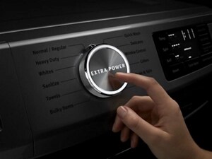 Finger pointing to an Extra Power Button on a Maytag® washer