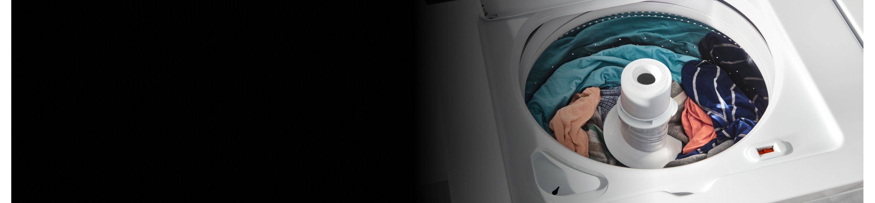 A load of orange, turquoise and blue clothes in a top load washer with an agitator