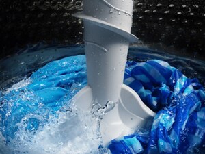 Blankets being washed in a washer