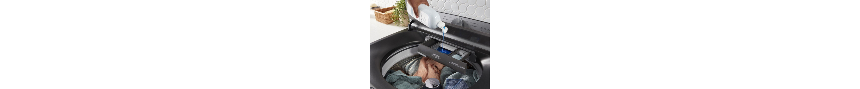 Hand adding Swash® detergent to a washer