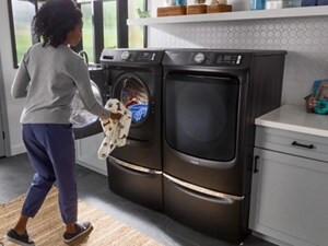 Person loading a front load washing machine