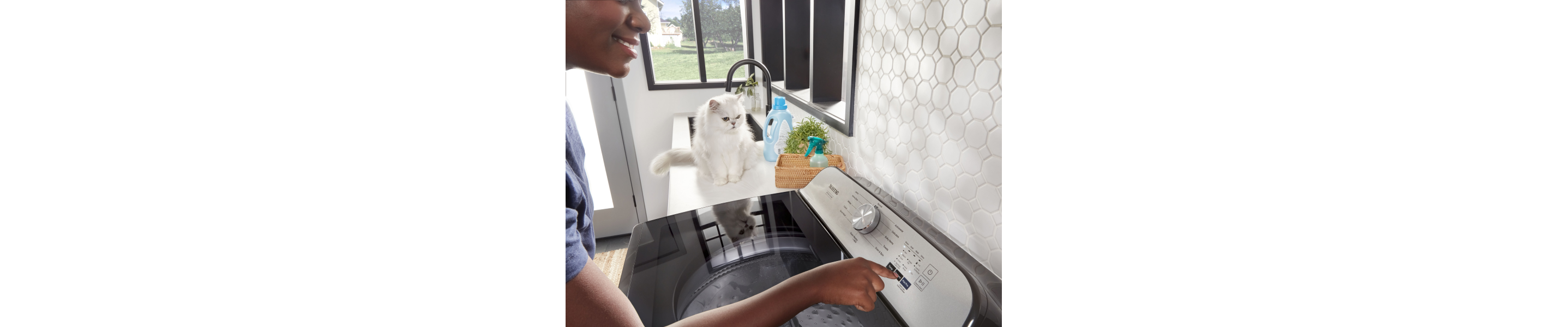 Person selecting cycle settings on their Maytag® washer. 
